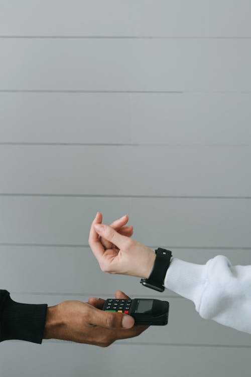 Free Person in White Long Sleeve Shirt Wearing Smartwatch Stock Photo