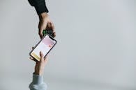 A Person Paying using a Smartphone