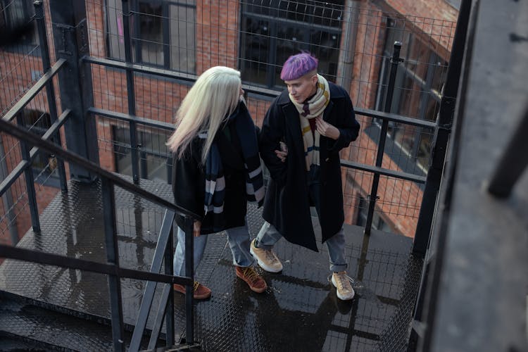 Women Walking Up The Stairs