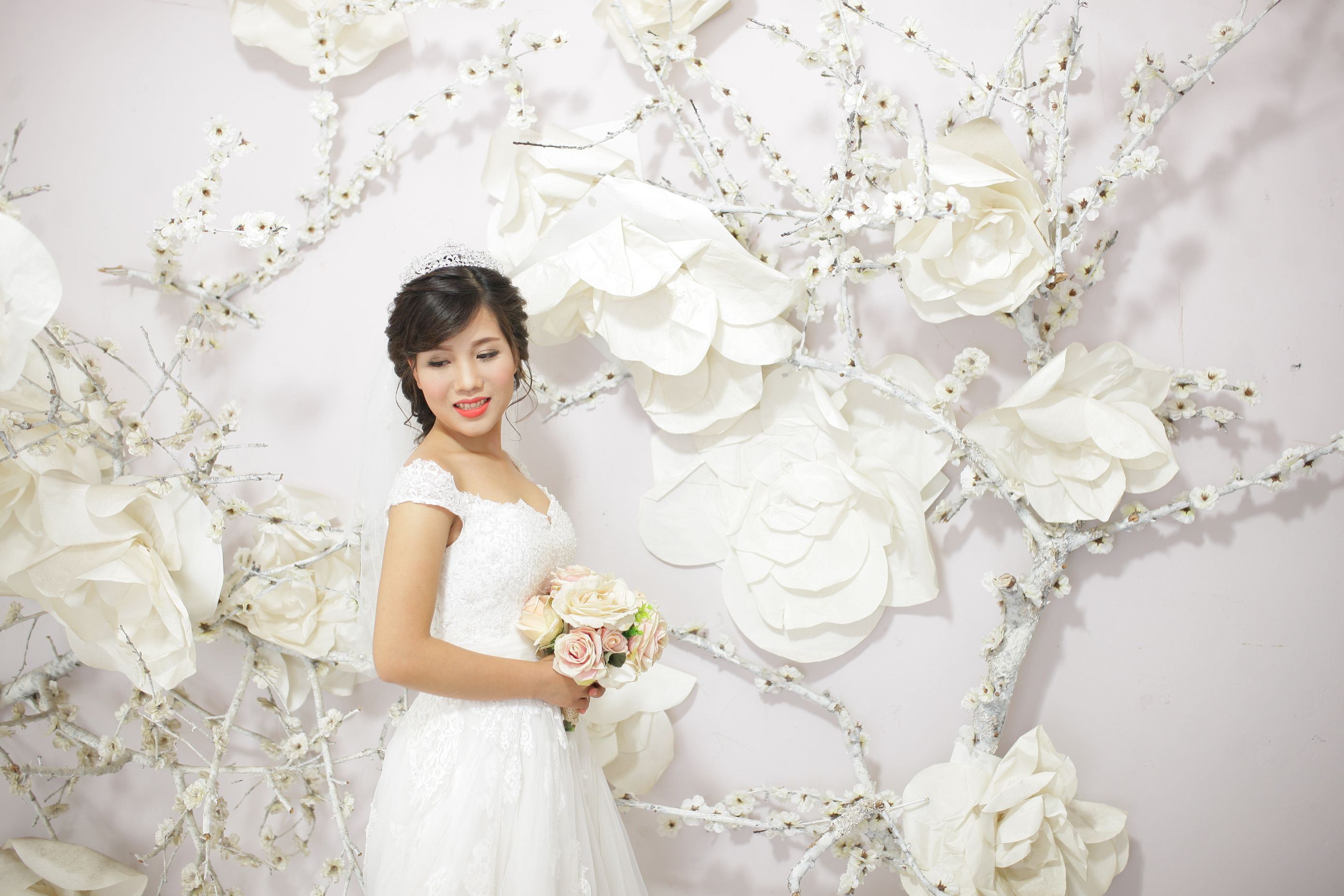 Woman in White Wedding Dress Holding Bouquet of Flowers · Free Stock Photo