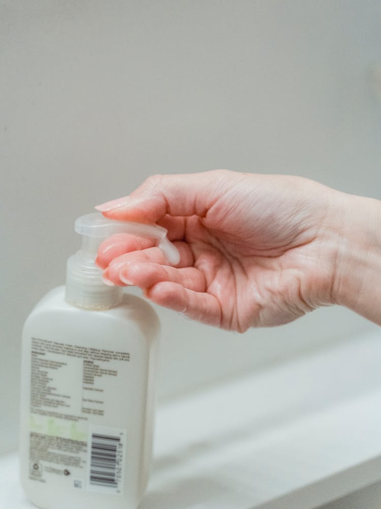 Female Hand With Liquid Soap