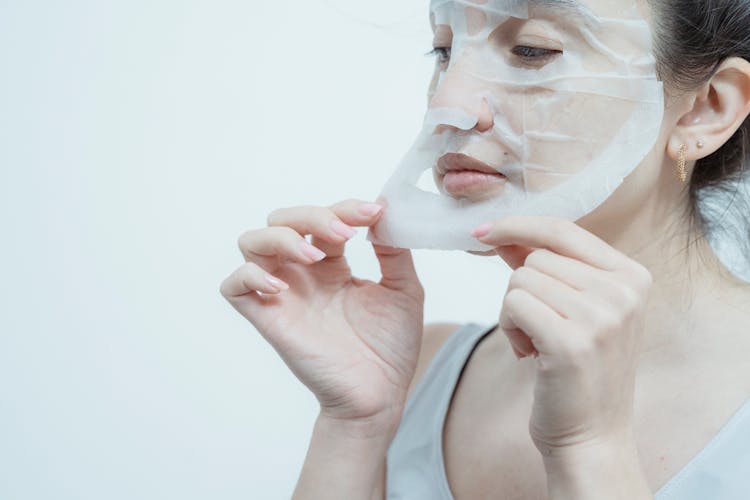 Woman Holding Face Mask