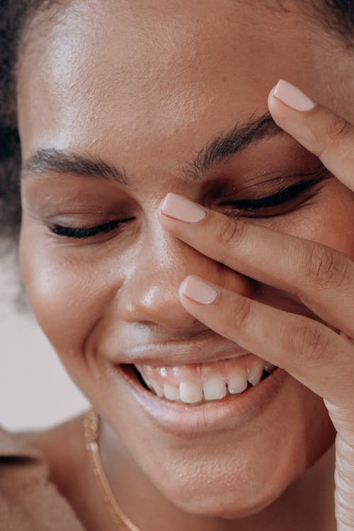 Close-Up Shot of a Woman Smiling