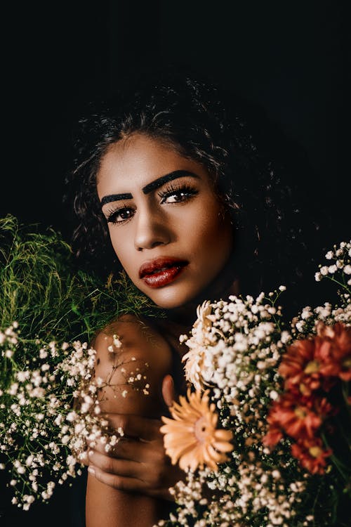 Woman Surrounded with Flowers