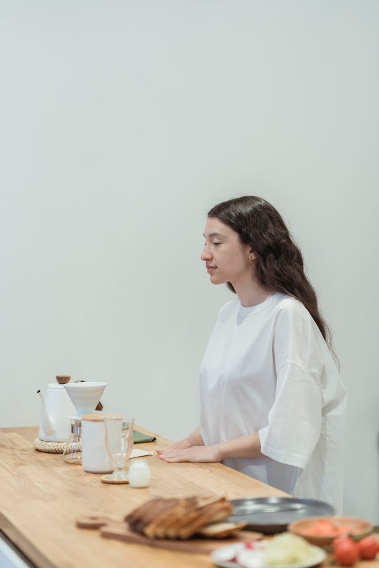 Woman Behind A Counter Serving Food 