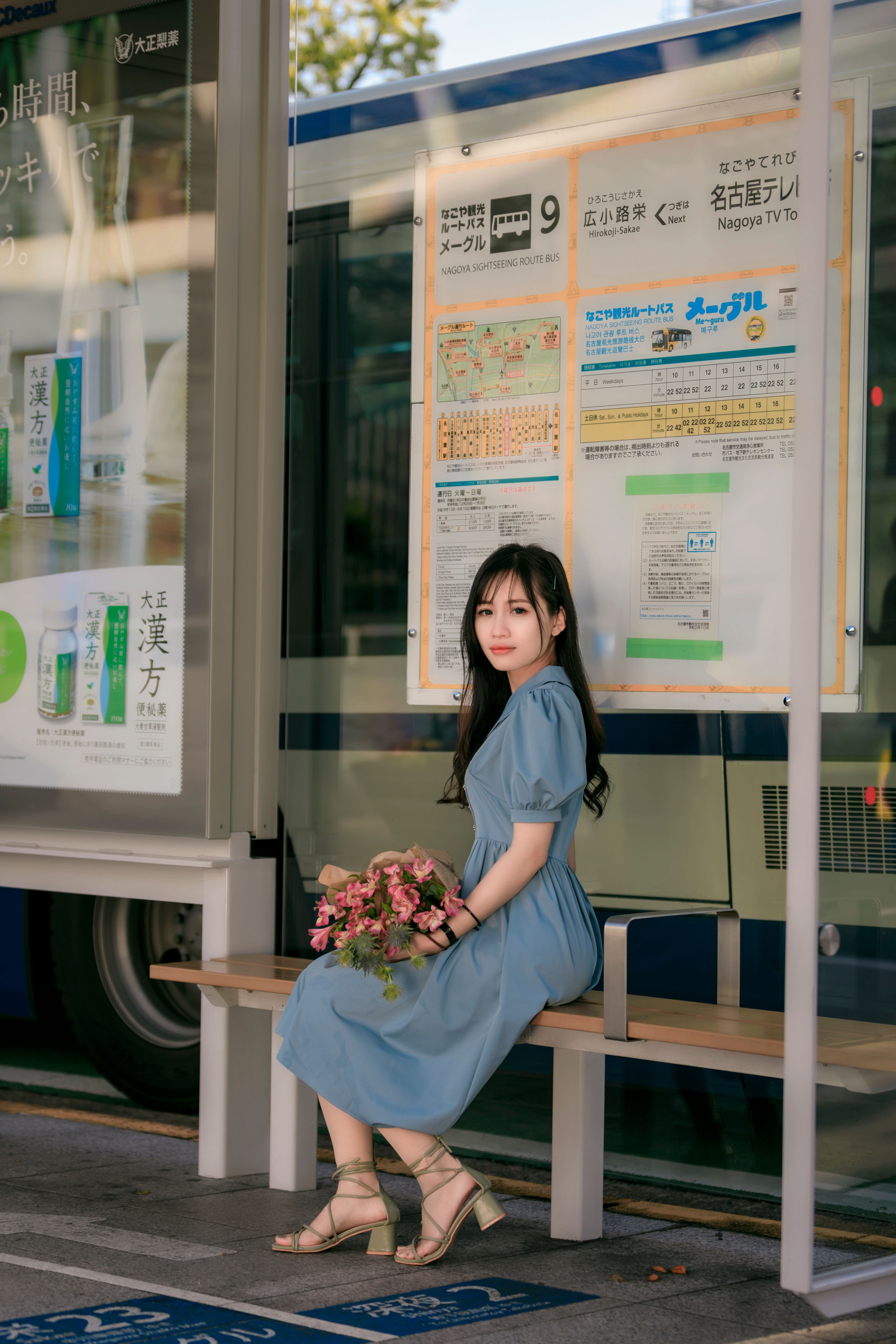 Woman in Blue Dress Sitting on a Bench · Free Stock Photo