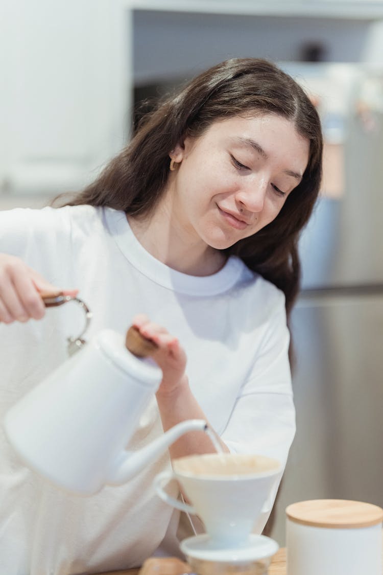 Woman Pouring Water To Cup