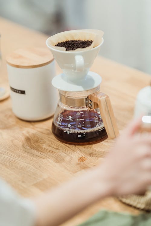 Free Coffee Pot on Brown Wooden Table Beside A Ceramic Cup Stock Photo