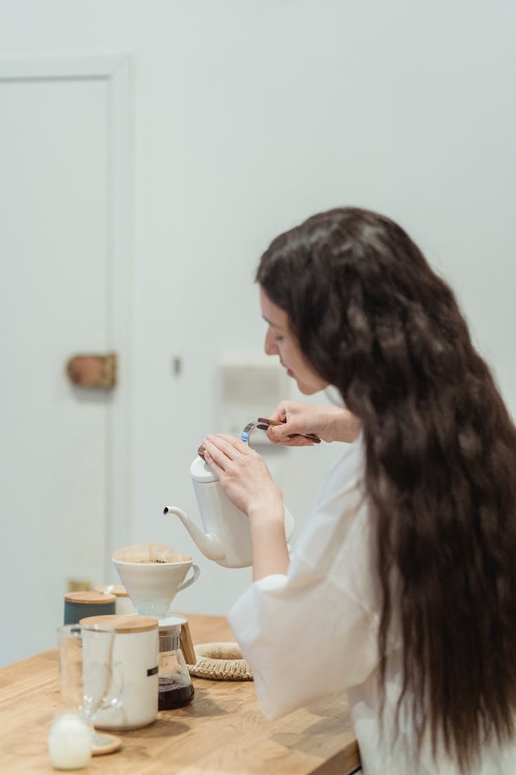 Woman Pouring Water To Cup