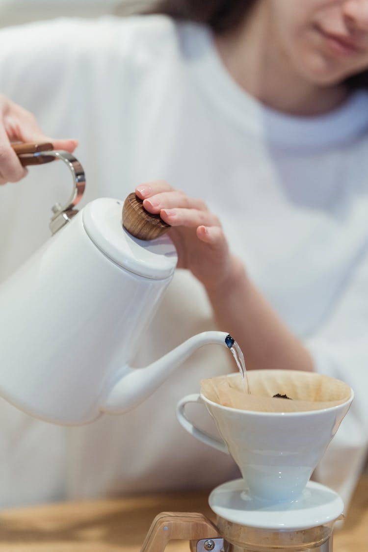 Woman Pouring Water To Cup