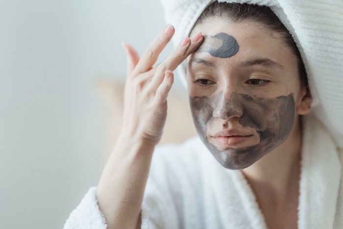 Facial mask application demonstrated during skin care training