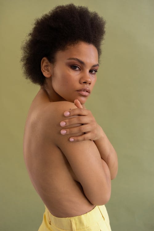 A Topless Afro-Haired Woman 