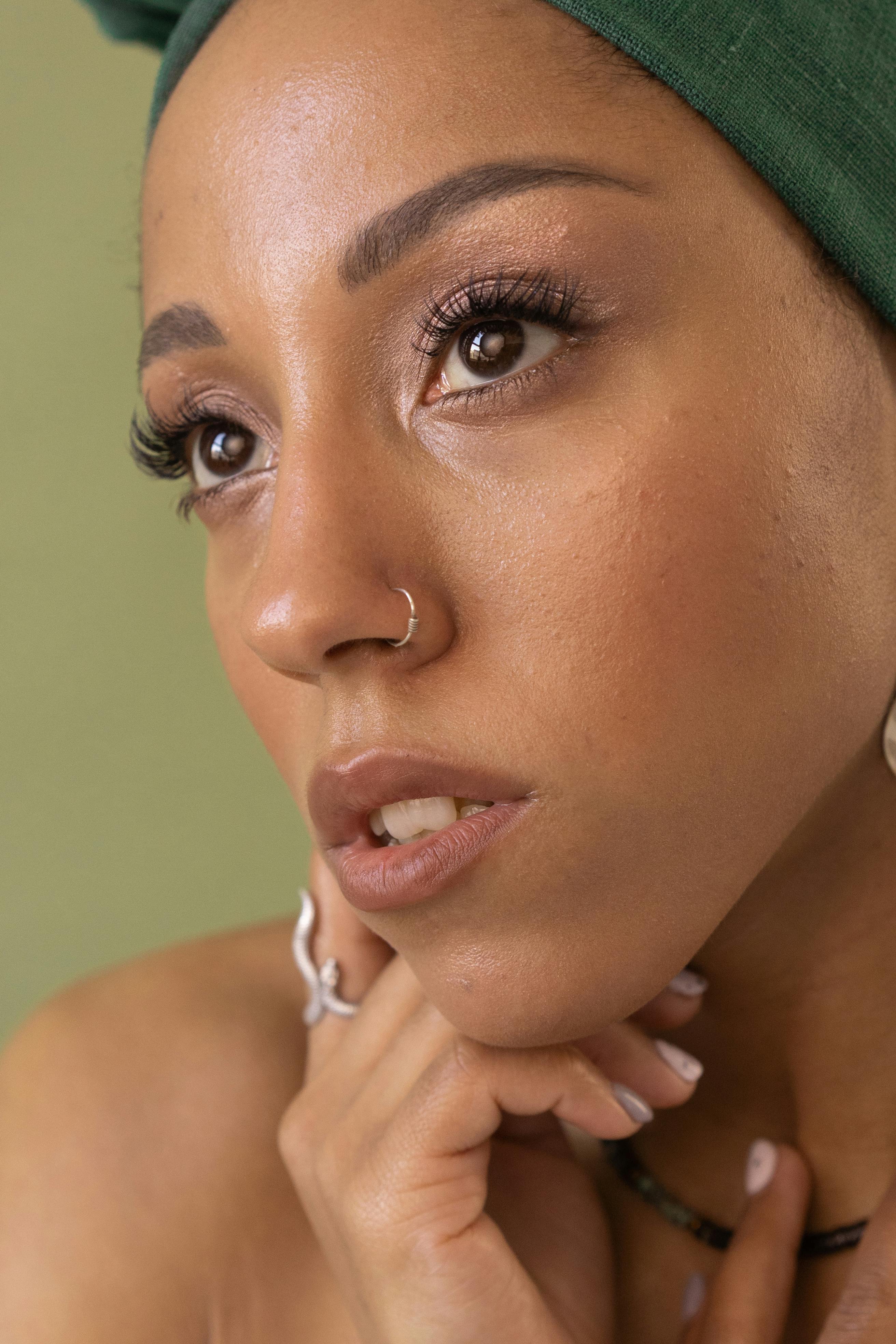 a portrait of a woman with nose ring