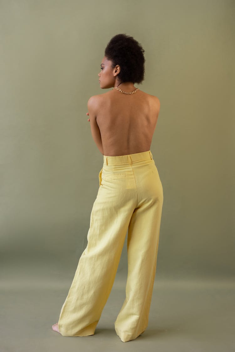 Shirtless Woman Wearing Yellow Pants