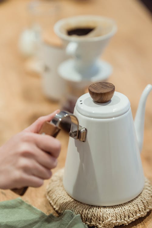 Free A Person Holding a Kettle Stock Photo