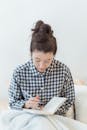 Woman in Checked Shirt Journaling