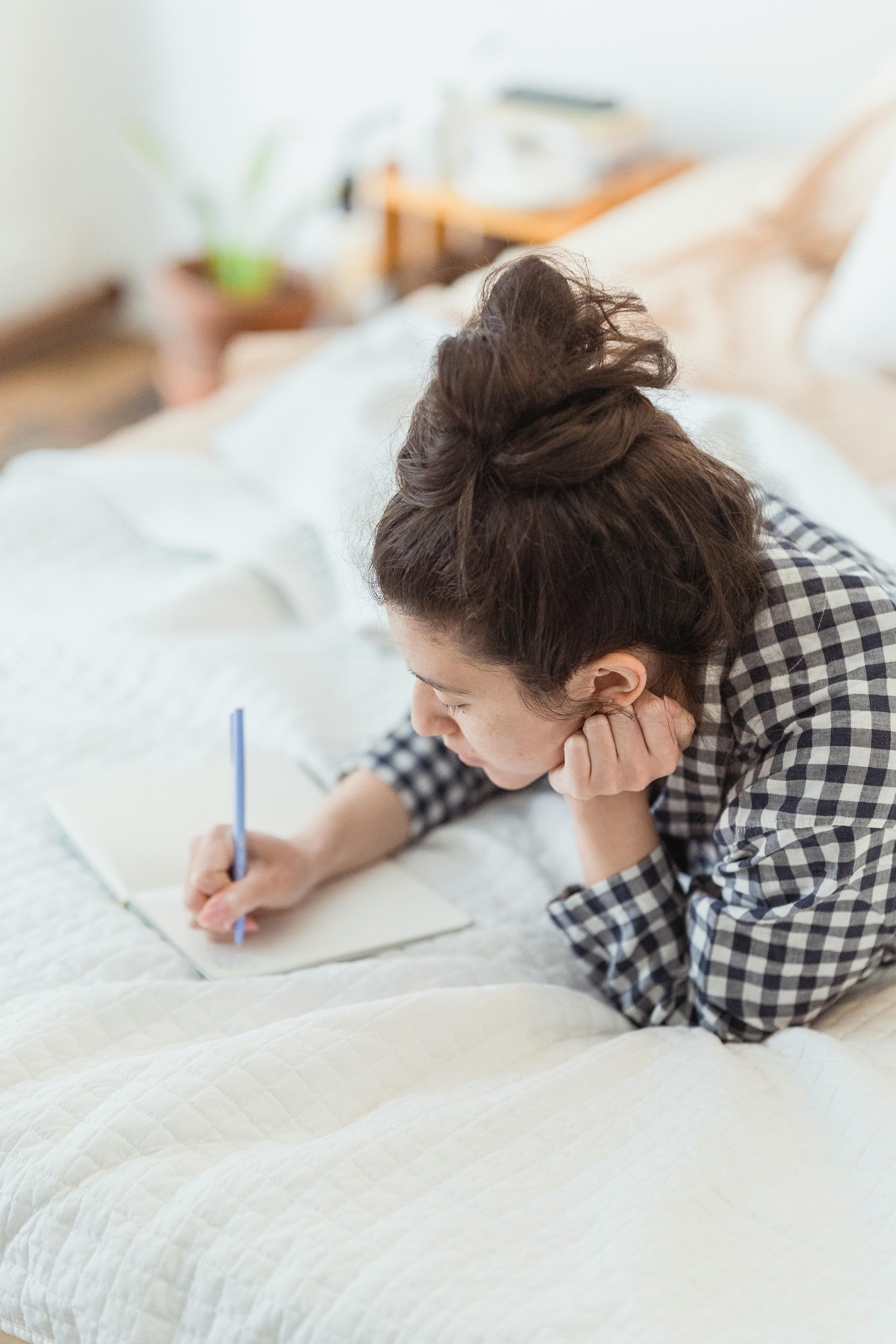 Writing Thoughts with Calm and Coffee Woman journaling quietly with a cup of coffee beside her