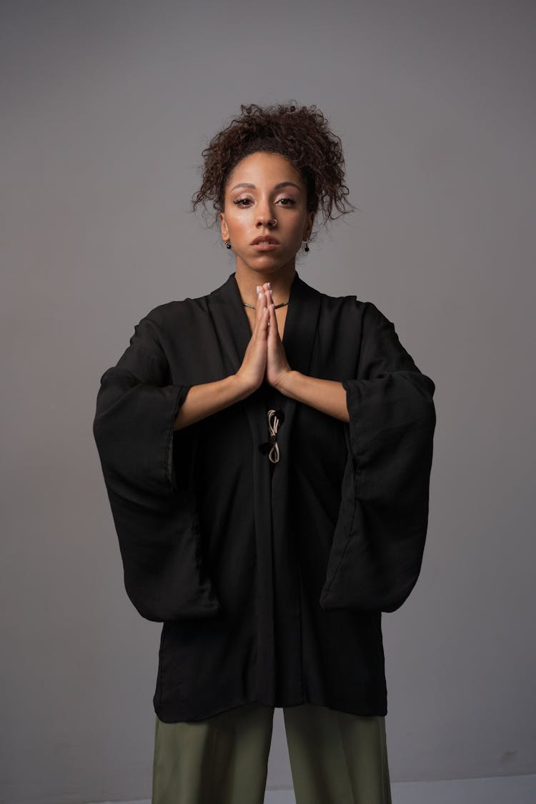 An Afro-Haired Woman In Black Robe 