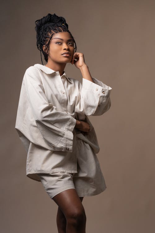 A Pretty Woman in Beige Long Sleeves Posing