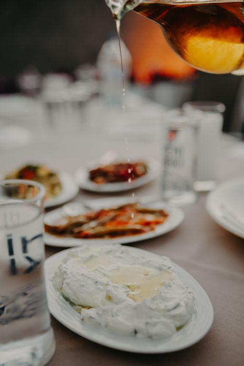 Free Scrumptious appetizer topped with olive oil, captured in a close-up shot. Perfect for food lovers. Stock Photo