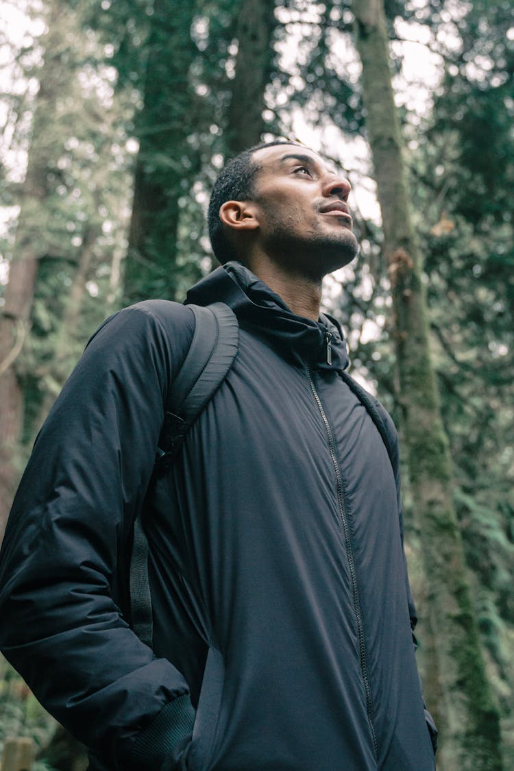 Man In Black Jacket Looking Upwards