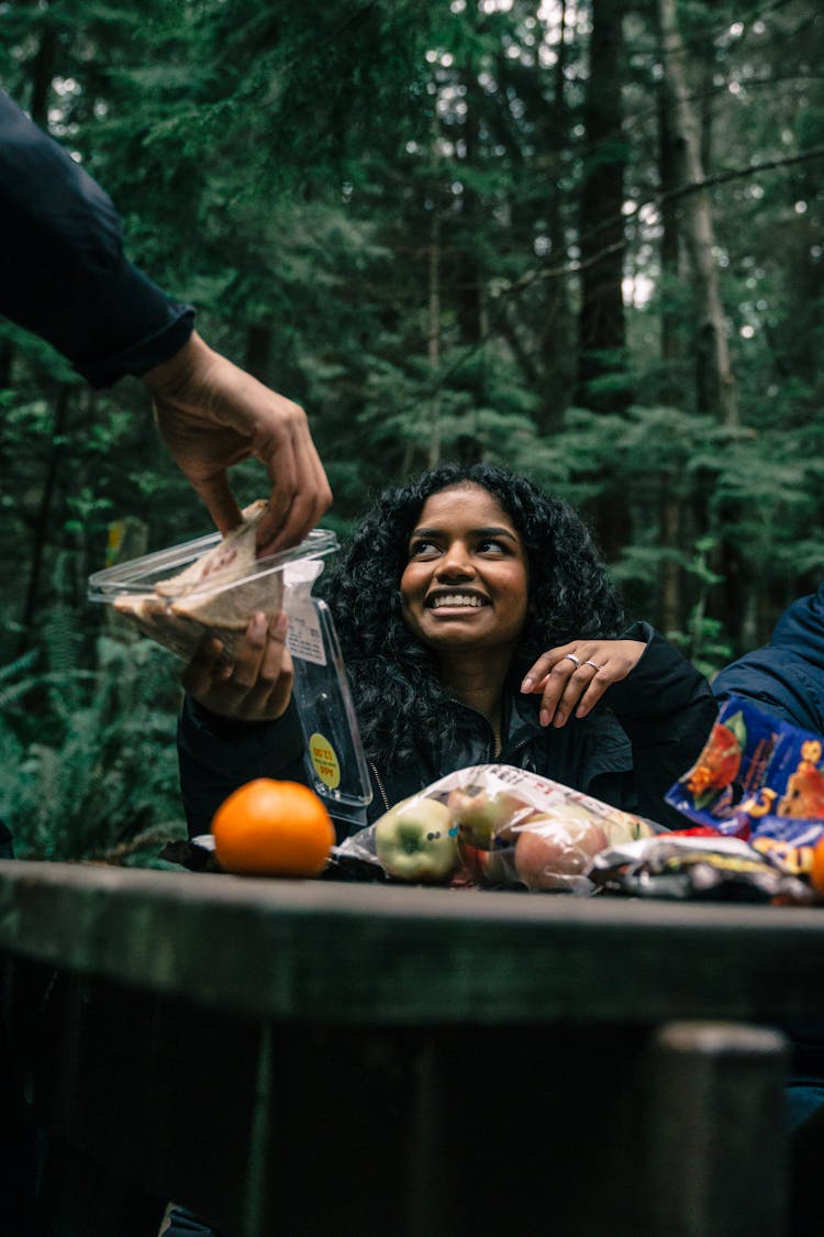 A Woman Sharing Her Sandwich