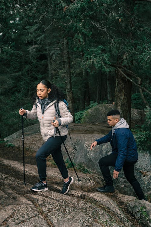 Man and Woman Hiking in a Forest