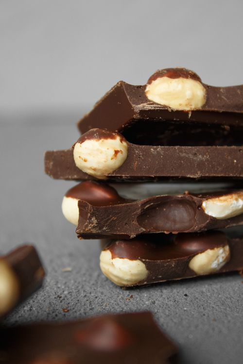 Free Stack of chocolate slices with embedded nuts in a close-up, showing texture and detail. Stock Photo
