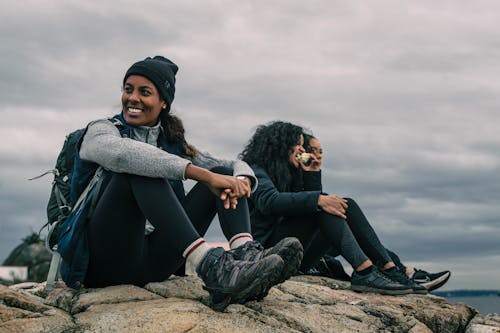 Women Sitting on a Cliff