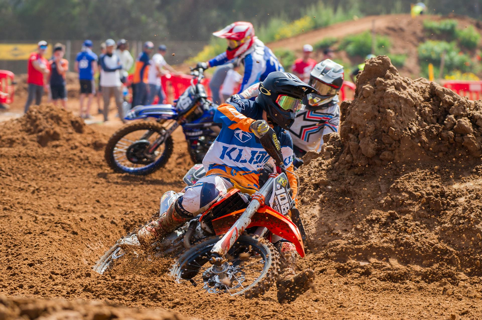 Men Riding In Motocross Dirt Bikes Racing on Track