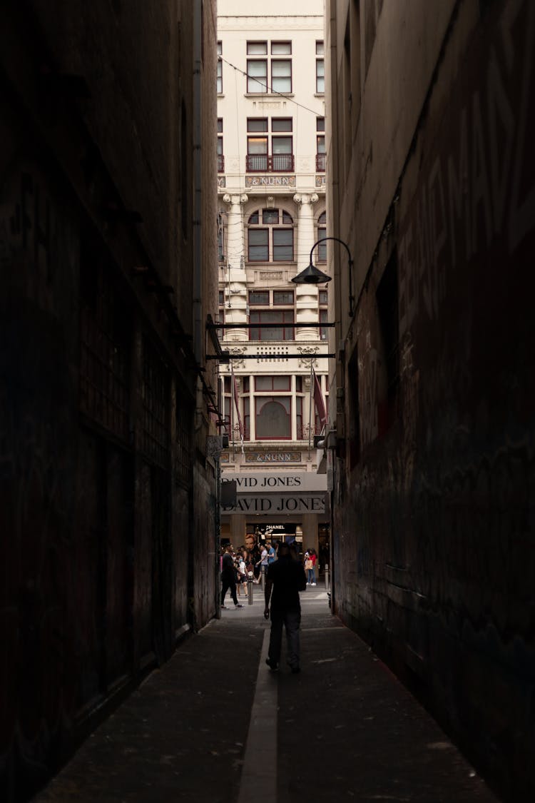 People Walking On The Alleyway