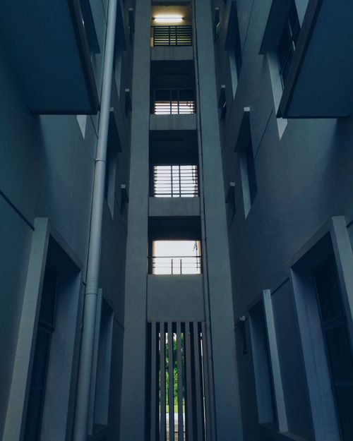 Free Futuristic perspective of urban architecture with tall structures and windows. Stock Photo