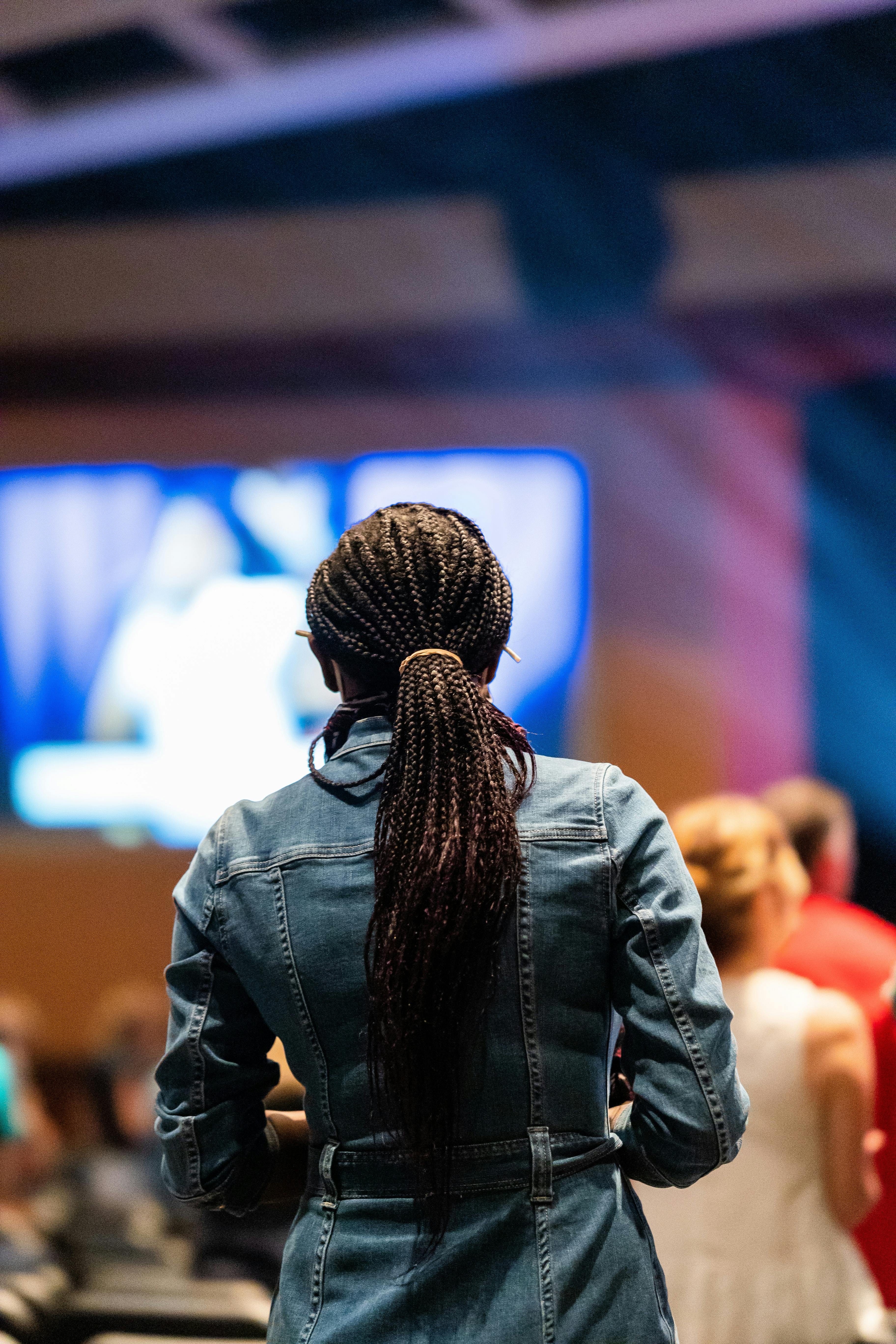 anonymous spectator in concert hall against stage