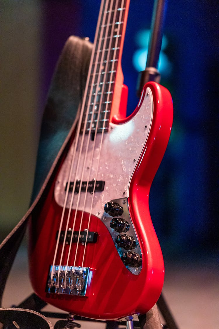 Bass Guitar With Knobs And Strap On Stage