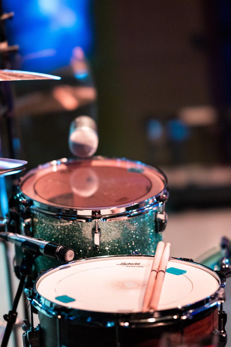 Drum Kit And Microphone On Stage In Night