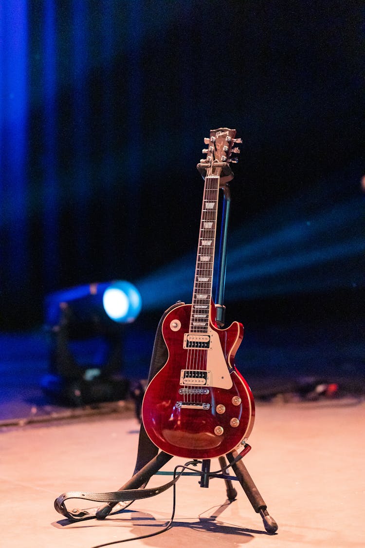 Modern Electric Guitar On Stage Against Spotlight