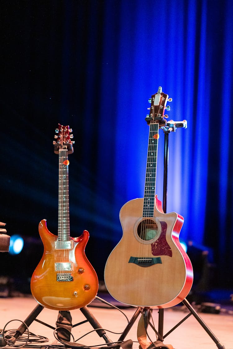 Guitars On Stage Against Blue Curtains