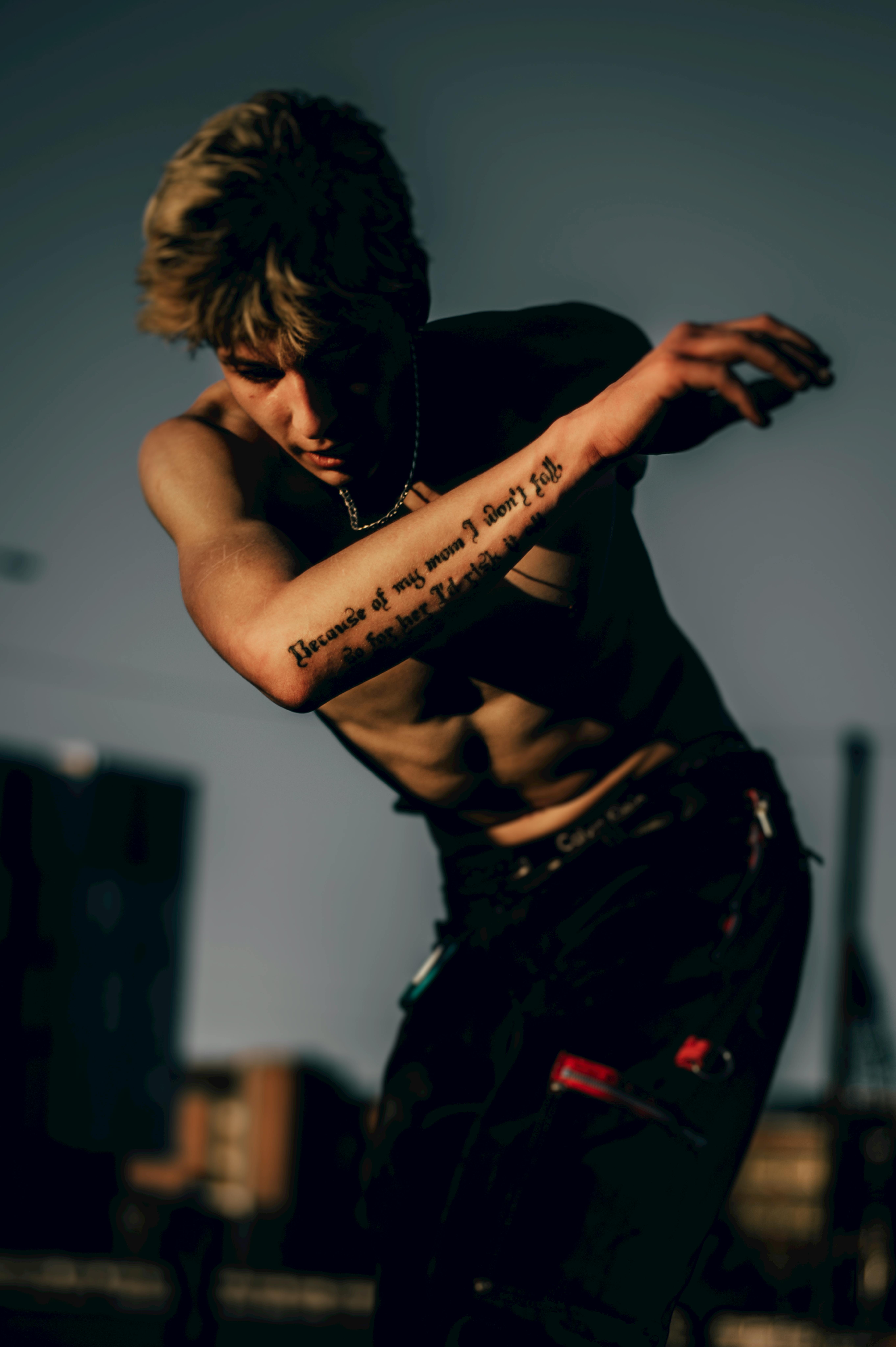A Shirtless Man with Arm Tattoo · Free Stock Photo A Shirtless Man with Arm Tattoo · Free Stock Photo
