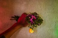 Anonymous person with bouquet of flowers