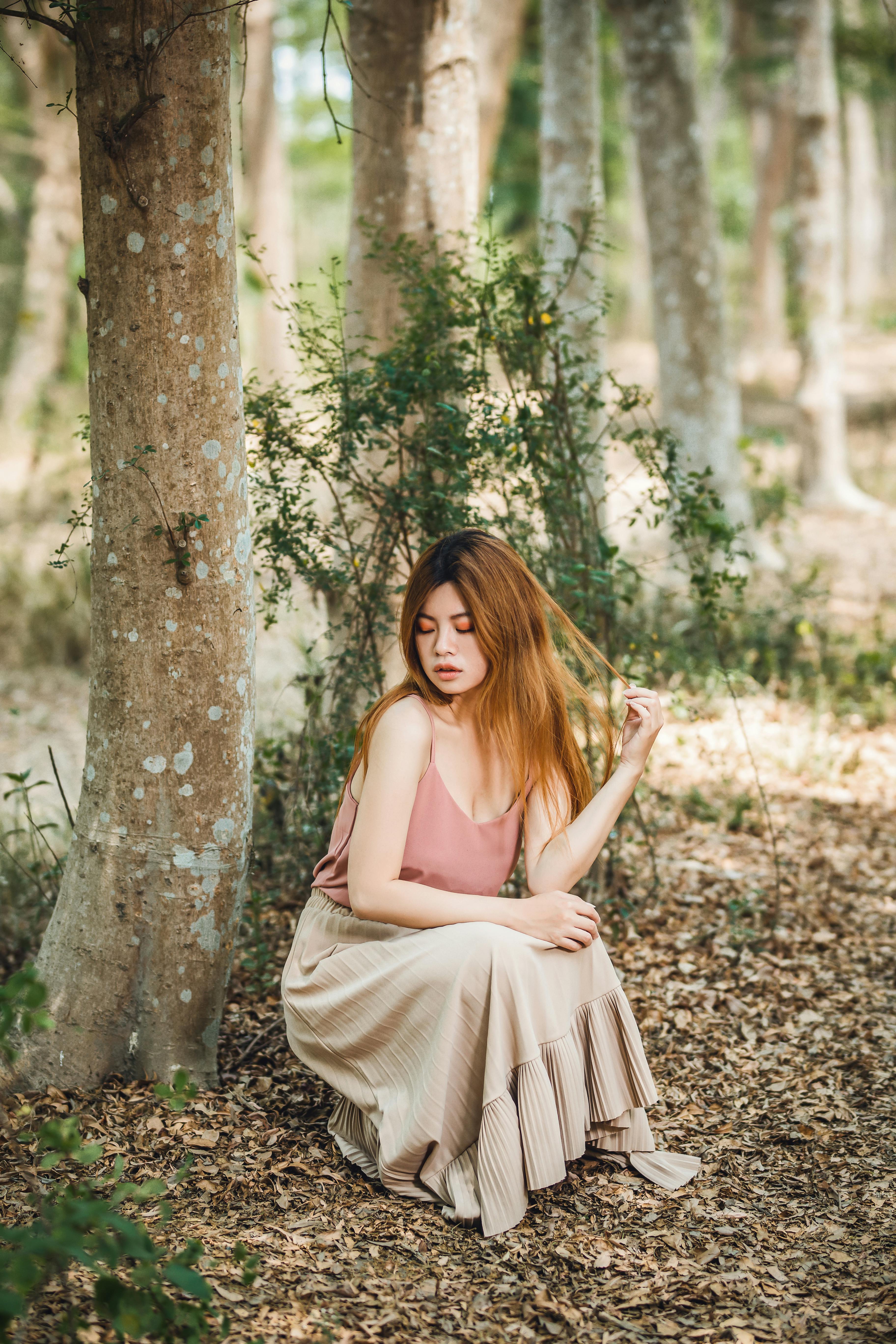 Woman Wearing Green Dress Posing in Forest · Free Stock Photo