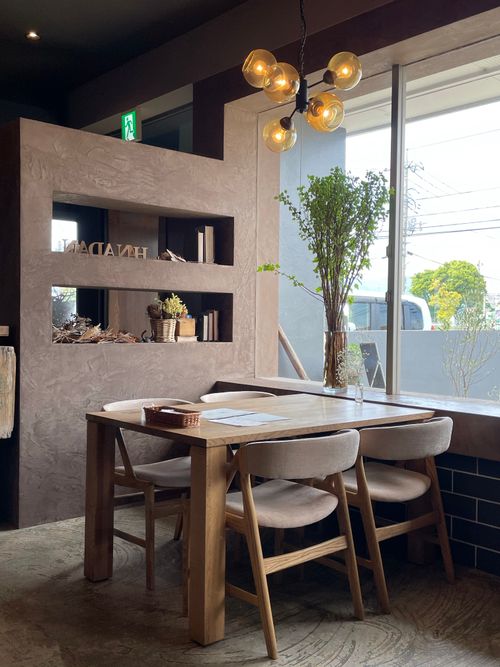 Free Inviting restaurant setting with elegant table, chairs, and ambient lighting. Stock Photo
