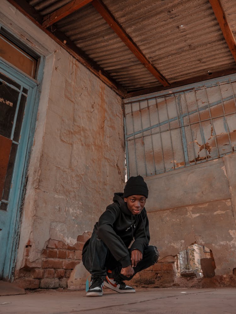 Portrait Of Man In Casual Clothing In Abandoned Building