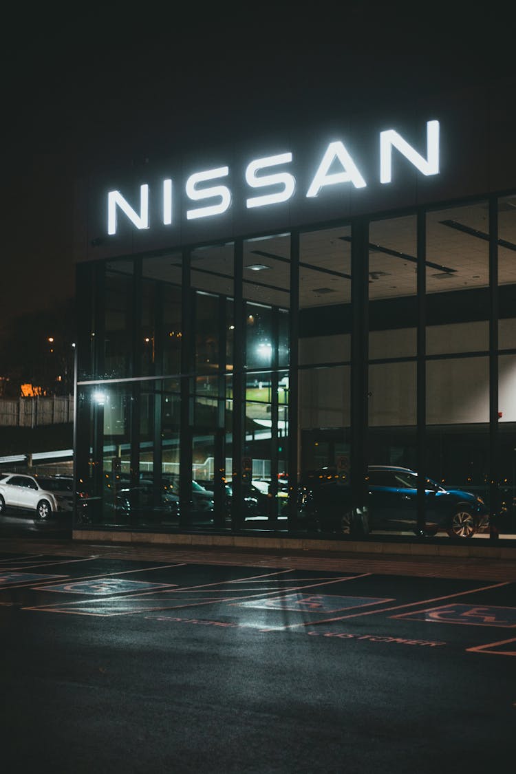 Car Dealership Building With Neon Sign