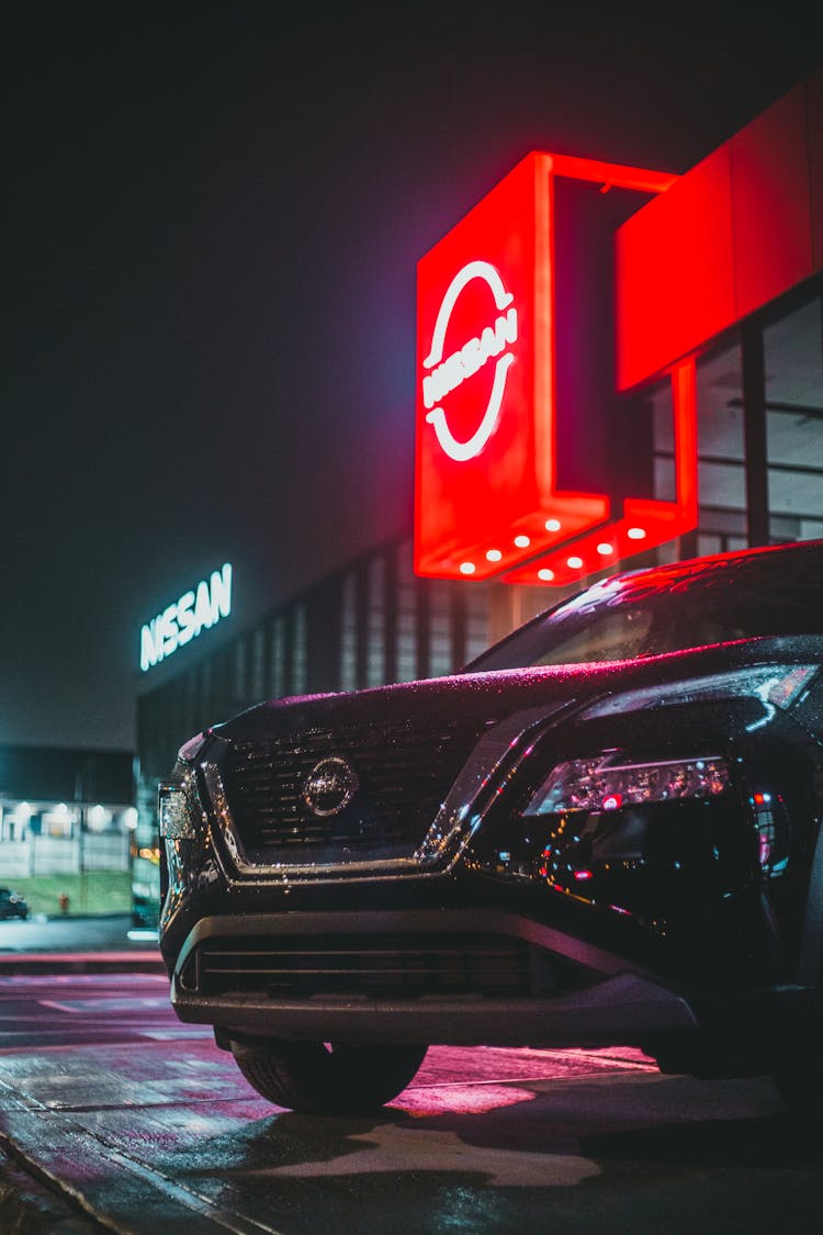 Luxury Vehicle Parked Near Car Dealership