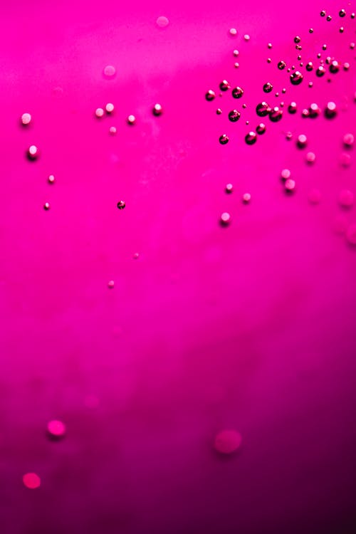Free Water Droplets on Pink Surface Stock Photo