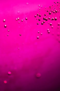A vibrant pink abstract background featuring floating bubbles, ideal for creative designs.