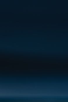 Deep blue abstract gradient with dark tones, perfect for backgrounds or artistic projects.