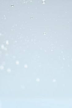 Abstract photo depicting water droplets with a smooth, bright, and delicate aesthetic.