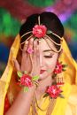 Woman in Yellow and Red Sari