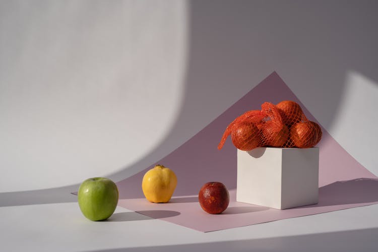 Photo Of Fruits Near A Cube